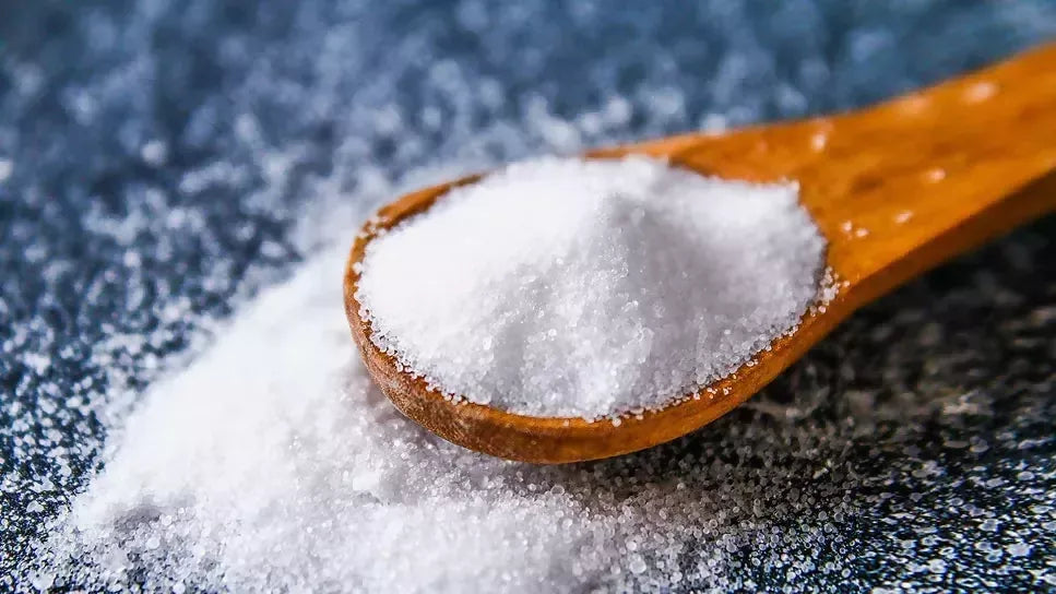 spoonful-salt-sitting-tabletop-1051727580
